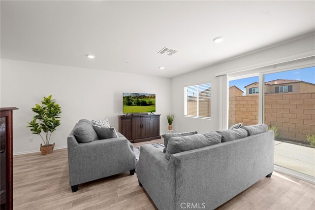 30769 Impala Ct, Winchester, CA 92596 - living room with light wood-style flooring, recessed lighting, and baseboards