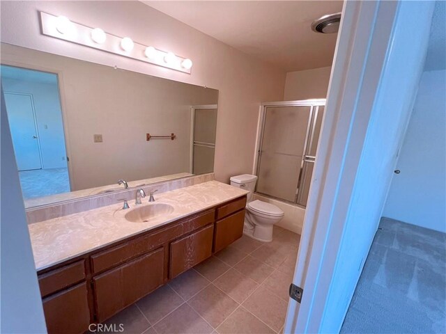 1509 E 23rd St Unit A, Signal Hill, CA 90755 - bathroom featuring vanity, tile patterned flooring, enclosed tub / shower combo, and toilet