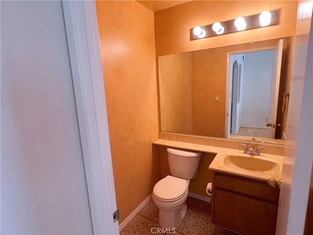 1509 E 23rd St Unit A, Signal Hill, CA 90755 - half bath featuring toilet, vanity, and baseboards