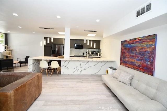 7309 Franklin Ave Unit 105, Los Angeles, CA 90046 - living area featuring light wood finished floors and recessed lighting