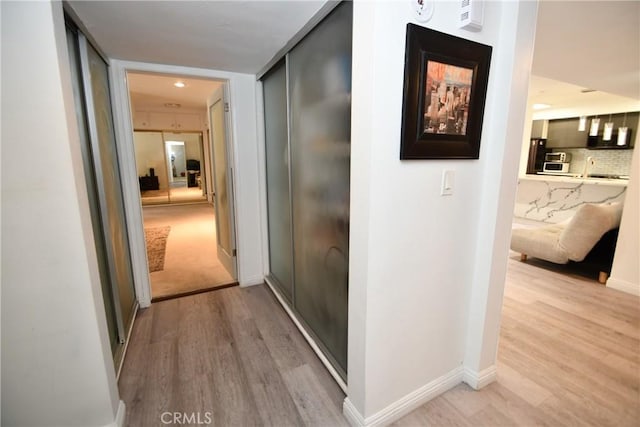 7309 Franklin Ave Unit 105, Los Angeles, CA 90046 - hall featuring wood finished floors and baseboards