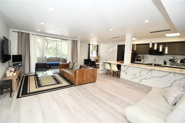 7309 Franklin Ave Unit 105, Los Angeles, CA 90046 - living area with light wood-style floors and recessed lighting