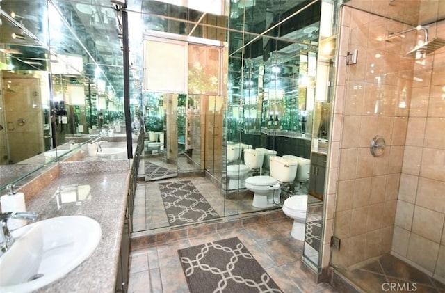 7309 Franklin Ave Unit 105, Los Angeles, CA 90046 - bathroom with toilet, a shower stall, double vanity, and a bidet