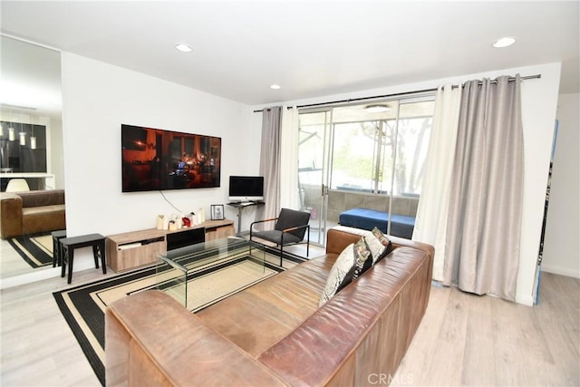 7309 Franklin Ave Unit 105, Los Angeles, CA 90046 - living room with light wood-type flooring, recessed lighting, and baseboards
