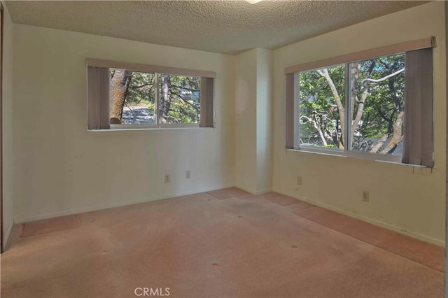 28680 Zion Dr, Lake Arrowhead, CA 92352 - spare room with carpet flooring, a textured ceiling, and baseboards