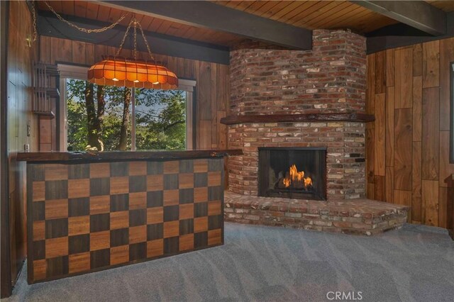 28680 Zion Dr, Lake Arrowhead, CA 92352 - unfurnished living room featuring wood walls, carpet floors, wooden ceiling with exposed beams, and a fireplace