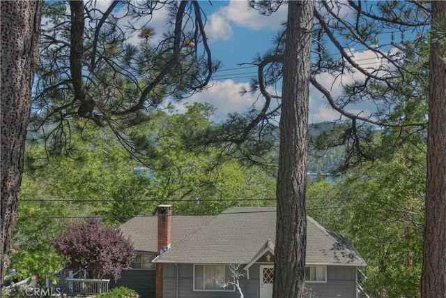 28680 Zion Dr, Lake Arrowhead, CA 92352 - exterior space with roof with shingles and a chimney