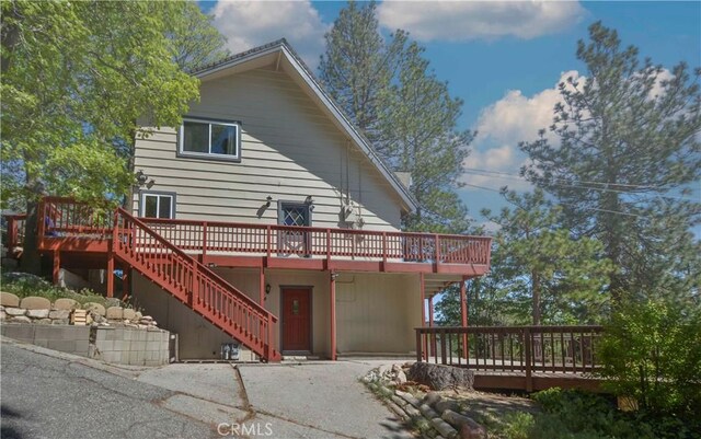 28680 Zion Dr, Lake Arrowhead, CA 92352 - back of property featuring a deck, a patio, and stairs