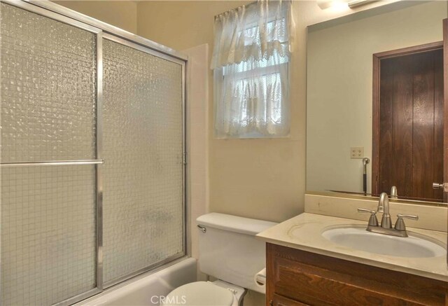 28680 Zion Dr, Lake Arrowhead, CA 92352 - full bath featuring vanity, combined bath / shower with glass door, and toilet