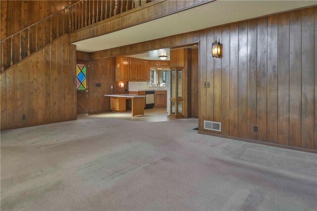 28680 Zion Dr, Lake Arrowhead, CA 92352 - unfurnished living room featuring wood walls and light colored carpet