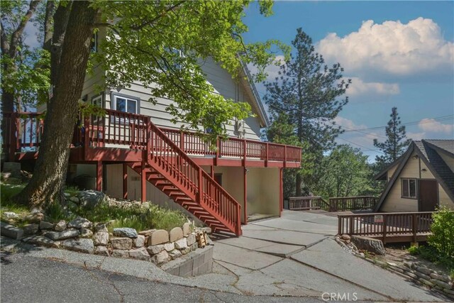 28680 Zion Dr, Lake Arrowhead, CA 92352 - view of side of home featuring stairs, a deck, and a patio area