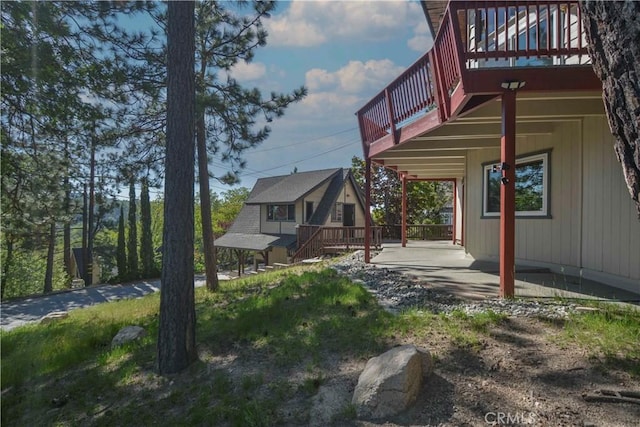 28680 Zion Dr, Lake Arrowhead, CA 92352 - rear view of property with a balcony and a wooden deck