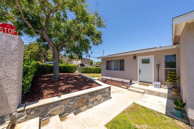 705 Pecos St, Spring Valley, CA 91977 - doorway to property featuring stucco siding
