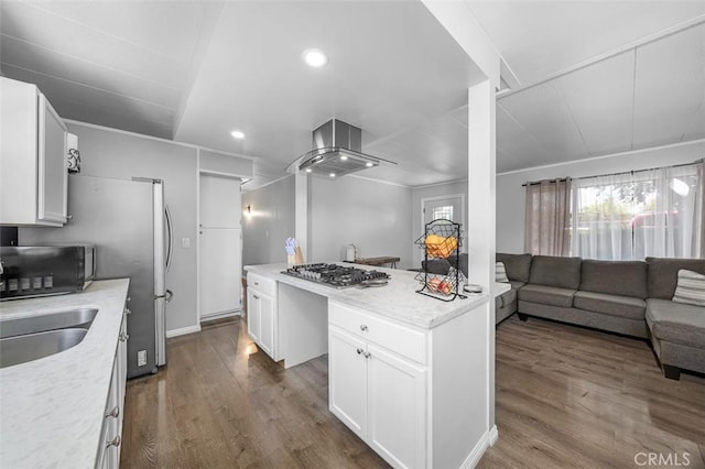 705 Pecos St, Spring Valley, CA 91977 - kitchen with black microwave, open floor plan, a center island, exhaust hood, and stainless steel gas cooktop