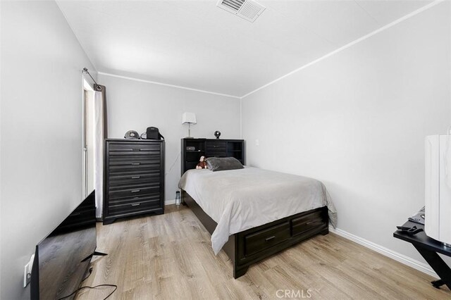 705 Pecos St, Spring Valley, CA 91977 - bedroom with light wood-style flooring and baseboards