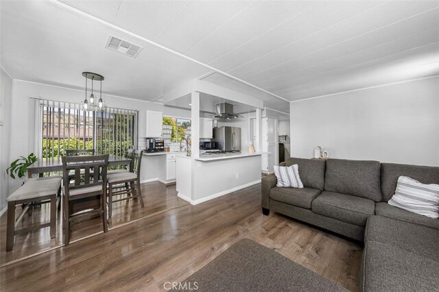 705 Pecos St, Spring Valley, CA 91977 - living room with dark wood finished floors and ceiling fan