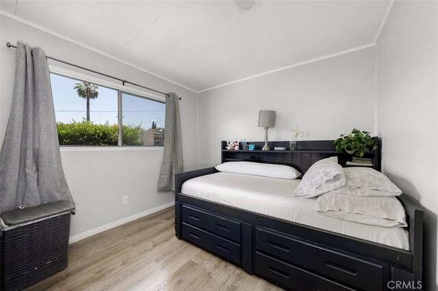 705 Pecos St, Spring Valley, CA 91977 - bedroom featuring light wood-type flooring, crown molding, and baseboards