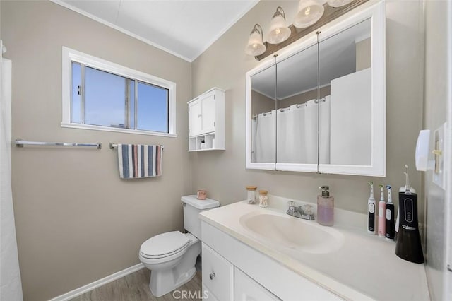 705 Pecos St, Spring Valley, CA 91977 - full bathroom featuring ornamental molding, vanity, toilet, wood finished floors, and baseboards