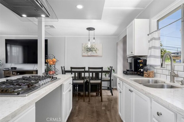 705 Pecos St, Spring Valley, CA 91977 - kitchen featuring stainless steel gas cooktop, a sink, white cabinets, dark wood-type flooring, and recessed lighting
