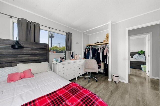 705 Pecos St, Spring Valley, CA 91977 - bedroom featuring wood finished floors, a closet, and baseboards