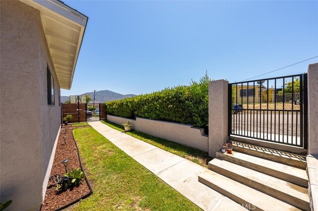 705 Pecos St, Spring Valley, CA 91977 - view of yard with a gate and a mountain view