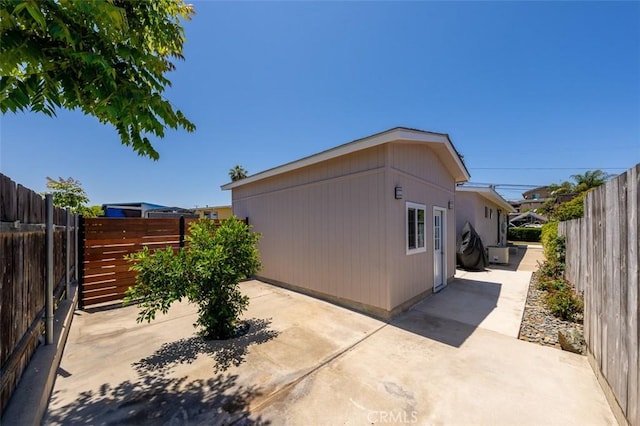 705 Pecos St, Spring Valley, CA 91977 - view of side of property featuring a patio and a fenced backyard