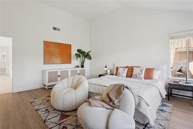 24775 Calle Serranona, Calabasas, CA 91302 - bedroom featuring high vaulted ceiling, wood finished floors, and baseboards