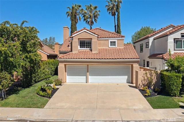 24775 Calle Serranona, Calabasas, CA 91302 - mediterranean / spanish house featuring a chimney, stucco siding, a tile roof, and driveway