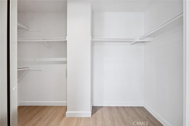 24775 Calle Serranona, Calabasas, CA 91302 - walk in closet featuring wood finished floors
