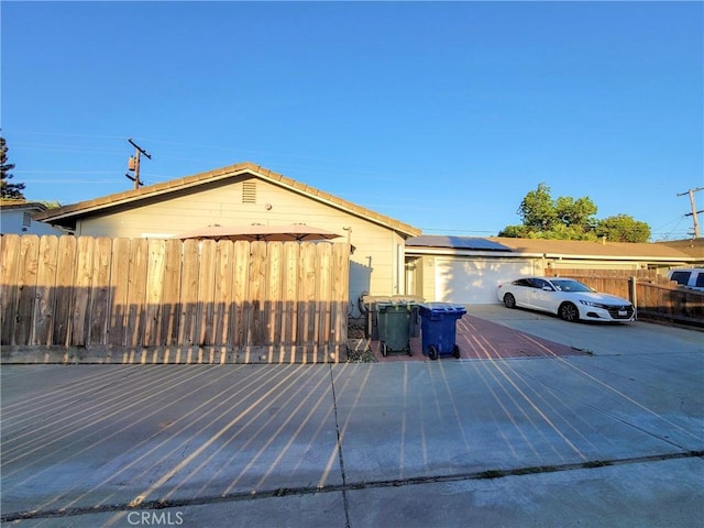 1485 Hansen Ave, Merced, CA 95340 - view of side of home with roof mounted solar panels and driveway