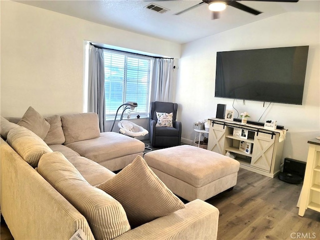 1485 Hansen Ave, Merced, CA 95340 - living area featuring a ceiling fan, wood finished floors, baseboards, and lofted ceiling