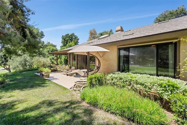 4119 Oak Island Ln, Fallbrook, CA 92028 - back of property featuring stucco siding, a yard, and a patio