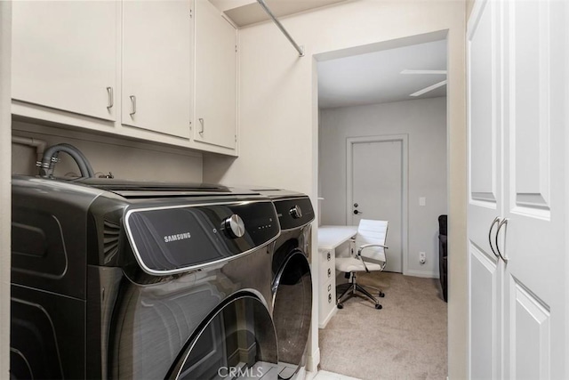 4119 Oak Island Ln, Fallbrook, CA 92028 - laundry room featuring washing machine and clothes dryer, cabinet space, light colored carpet, and a desk