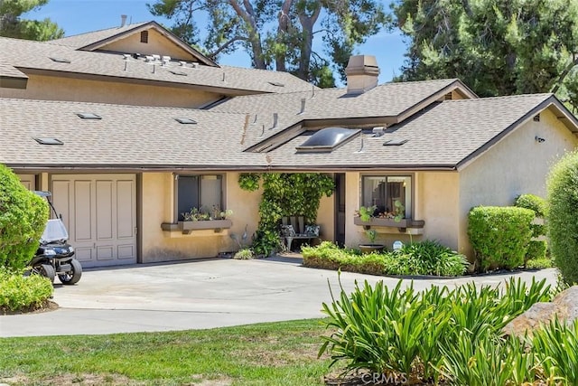 4119 Oak Island Ln, Fallbrook, CA 92028 - back of house with a shingled roof, a chimney, concrete driveway, and stucco siding