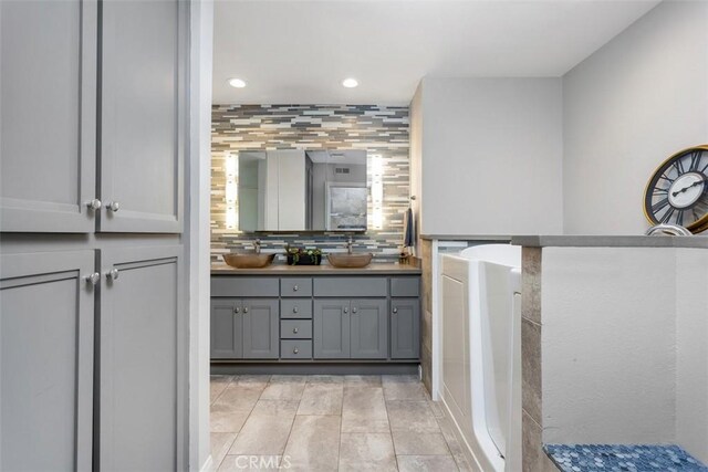 4119 Oak Island Ln, Fallbrook, CA 92028 - bathroom with double vanity, recessed lighting, and backsplash