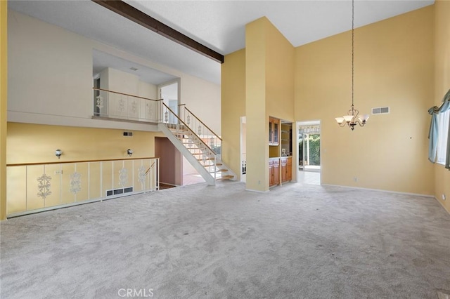 1713 Roanoke St, Placentia, CA 92870 - unfurnished living room with a chandelier, a high ceiling, carpet flooring, stairs, and baseboards