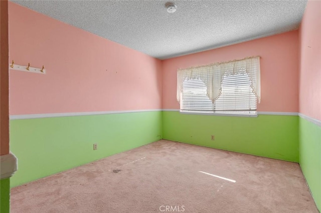 1713 Roanoke St, Placentia, CA 92870 - spare room featuring carpet flooring, a smoke detector, and a textured ceiling