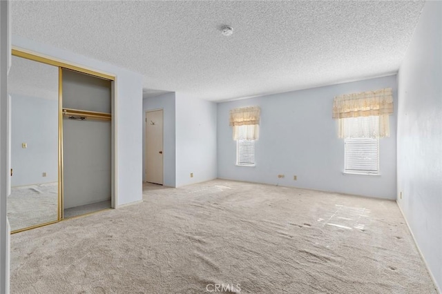 1713 Roanoke St, Placentia, CA 92870 - unfurnished bedroom with carpet flooring, a textured ceiling, and a closet