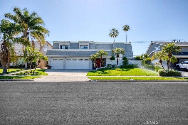 1713 Roanoke St, Placentia, CA 92870 - view of front of property with a garage, driveway, mansard roof, a front yard, and a shingled roof