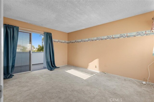 1713 Roanoke St, Placentia, CA 92870 - carpeted spare room with a textured ceiling and baseboards