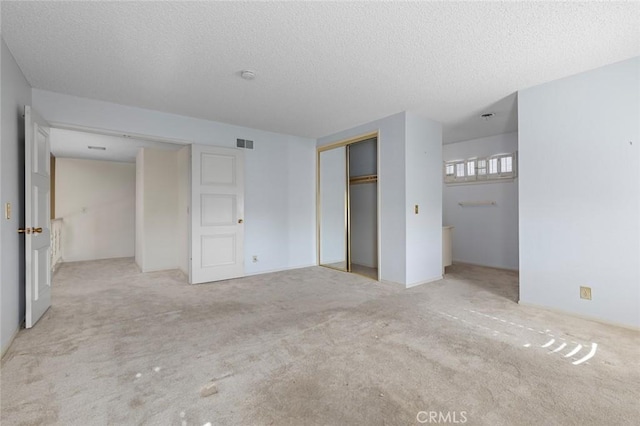 1713 Roanoke St, Placentia, CA 92870 - unfurnished bedroom with a textured ceiling, carpet, and a closet