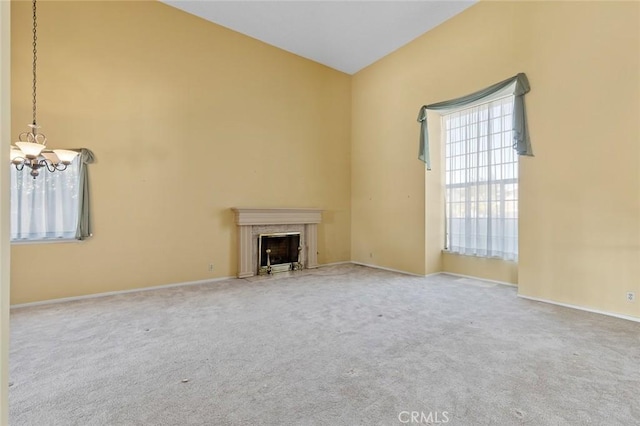 1713 Roanoke St, Placentia, CA 92870 - unfurnished living room with a chandelier, carpet flooring, a high end fireplace, and baseboards