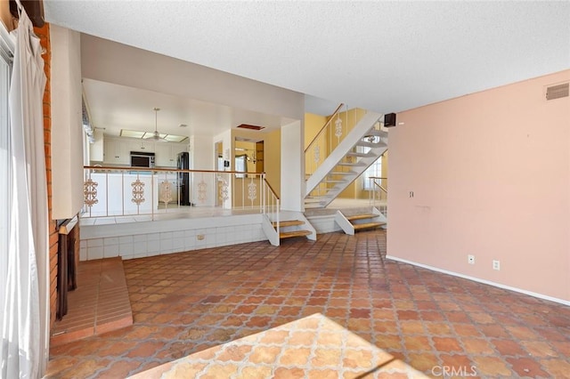 1713 Roanoke St, Placentia, CA 92870 - unfurnished living room with stairs and baseboards