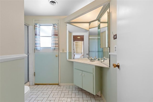 1713 Roanoke St, Placentia, CA 92870 - bathroom with vanity, toilet, an enclosed shower, and baseboards