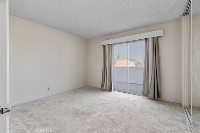1713 Roanoke St, Placentia, CA 92870 - carpeted empty room with a textured ceiling