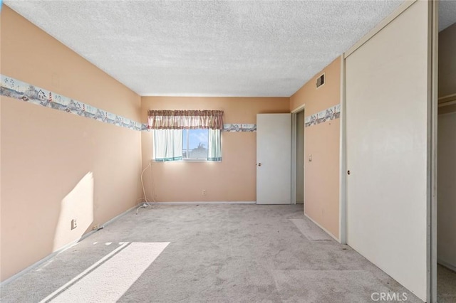 1713 Roanoke St, Placentia, CA 92870 - spare room with carpet flooring, a textured ceiling, and baseboards