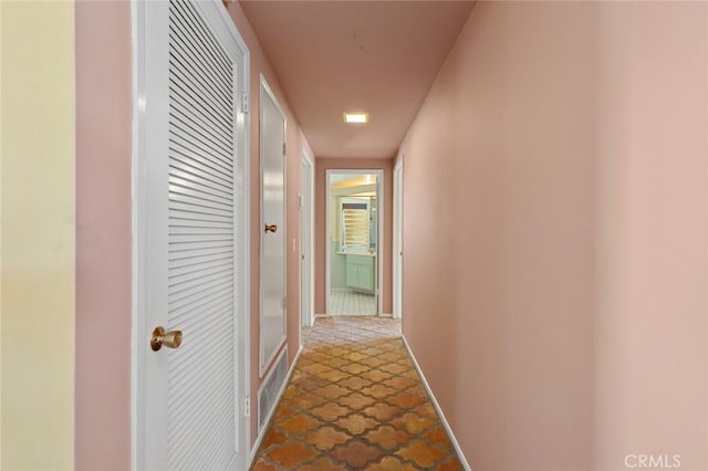 1713 Roanoke St, Placentia, CA 92870 - hall featuring baseboards and stone finish floors