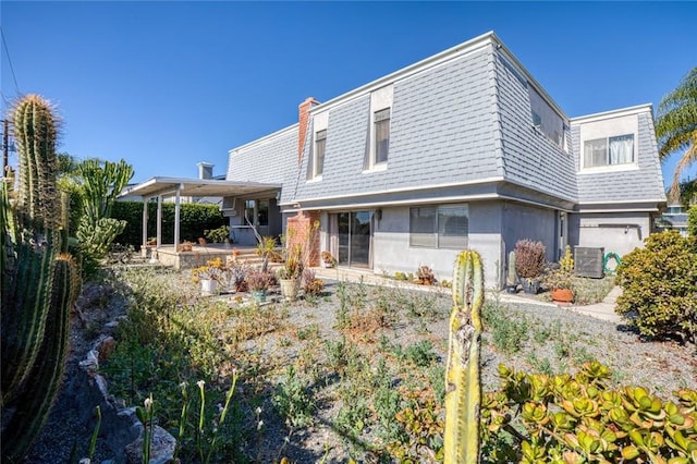 1713 Roanoke St, Placentia, CA 92870 - view of front of house featuring cooling unit, stucco siding, and a chimney