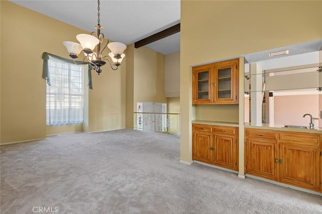 1713 Roanoke St, Placentia, CA 92870 - unfurnished dining area with a sink, light carpet, a chandelier, and baseboards