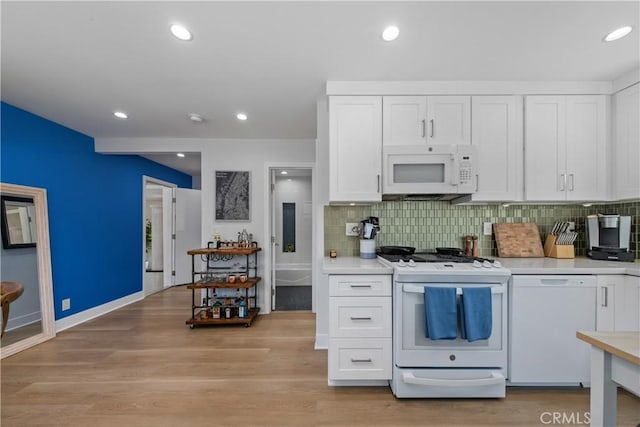 21322 S Western Ave, Torrance, CA 90501 - kitchen with white appliances, white cabinets, light countertops, backsplash, and recessed lighting